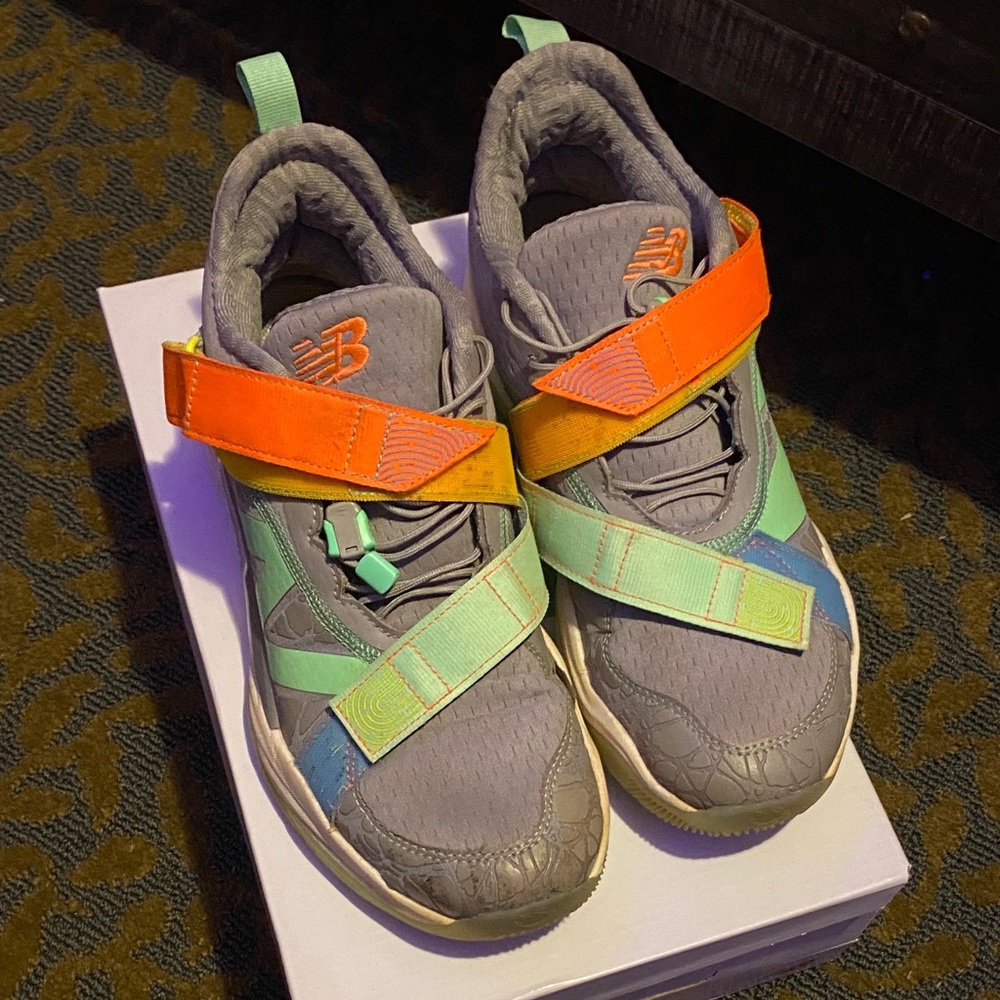 New Balance men’s ' Gray Sneakers with Orange and Green Accents